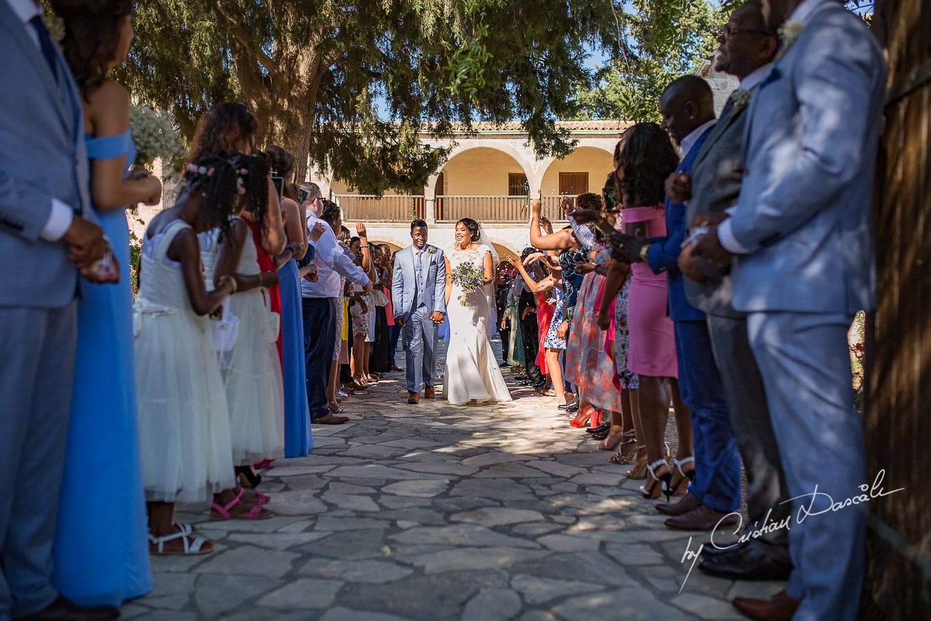 Beautiful ceremony moments captured at a wedding at Minthis Hills in Cyprus, by Cristian Dascalu.