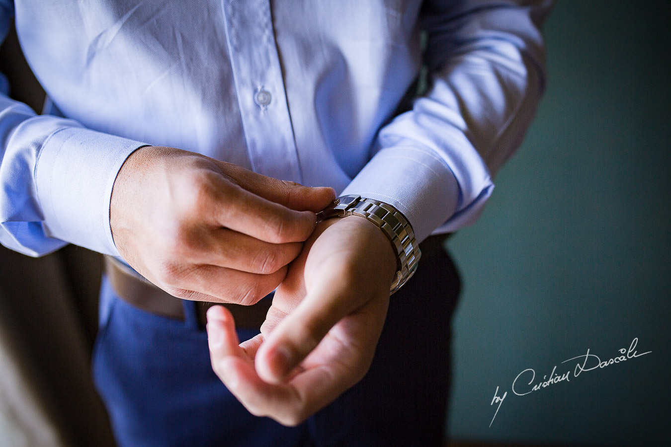 Genuine moments with the groom getting ready as part of an Exclusive Wedding photography at Grand Resort Limassol, captured by Cyprus Wedding Photographer Cristian Dascalu.