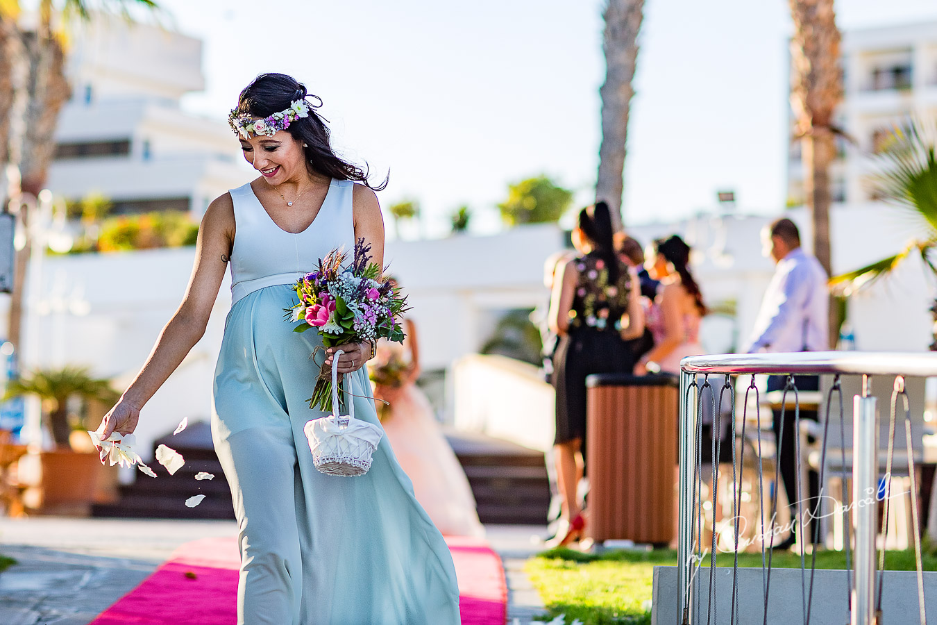 Bridesmaid photographed during the ceremony, as part of an Exclusive Wedding photography at Grand Resort Limassol, captured by Cyprus Wedding Photographer Cristian Dascalu.