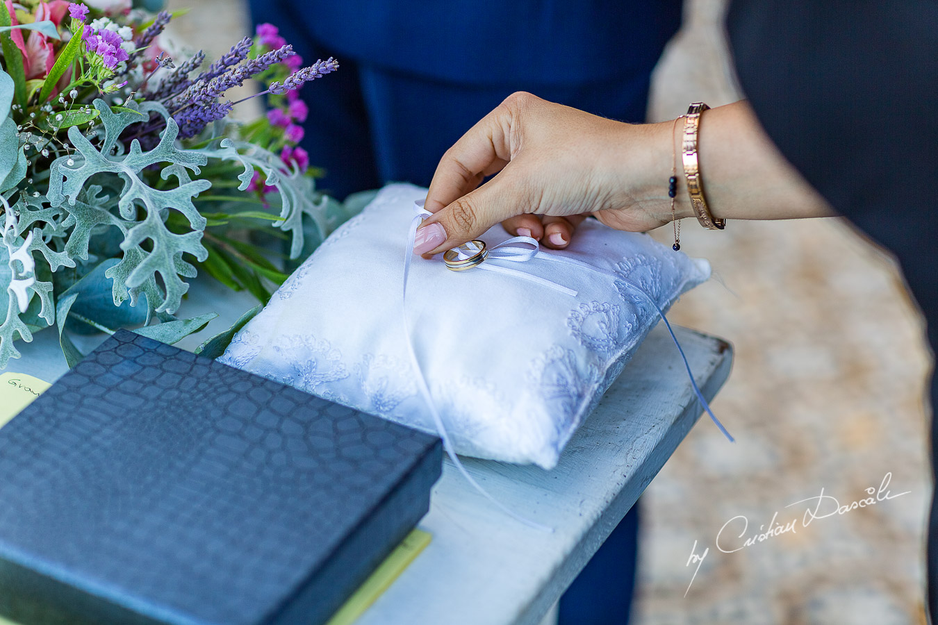 Wedding rings photographed during the ceremony, as part of an Exclusive Wedding photography at Grand Resort Limassol, captured by Cyprus Wedding Photographer Cristian Dascalu.