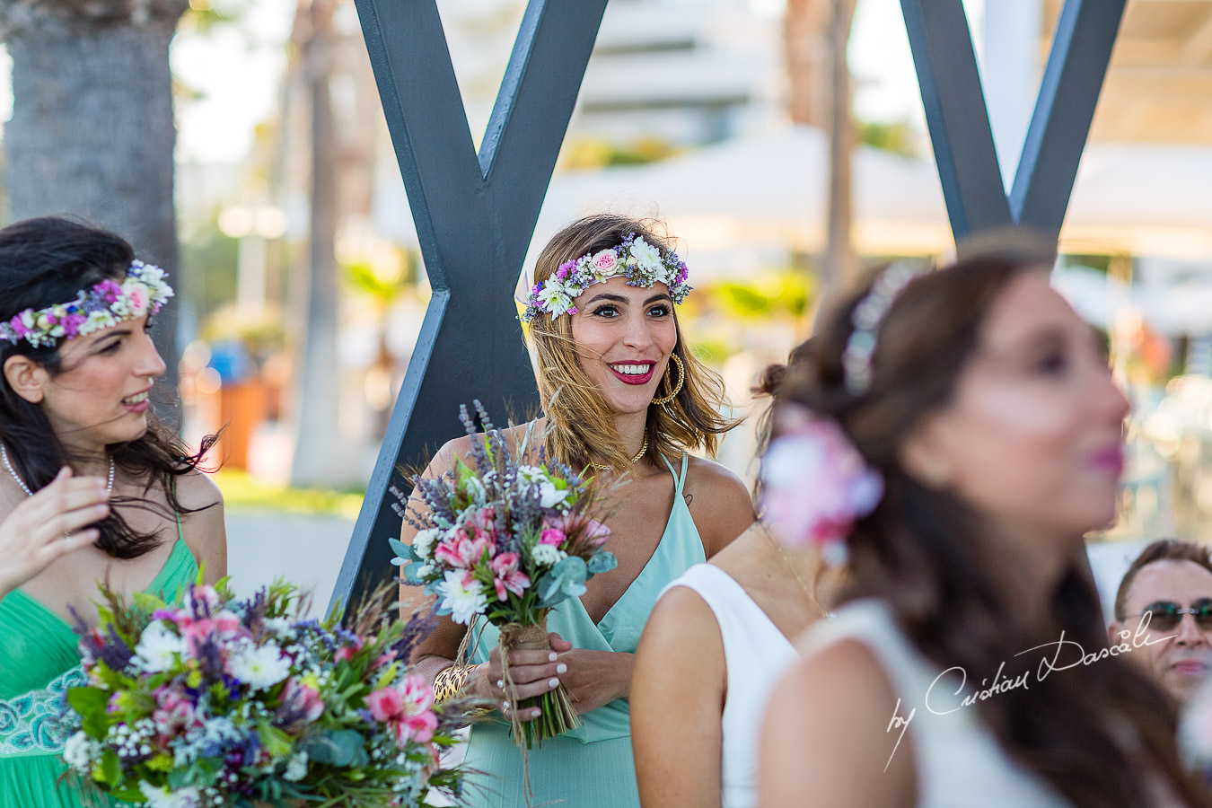 Genuine moments with the bridesmaids during the ceremony, as part of an Exclusive Wedding photography at Grand Resort Limassol, captured by Cyprus Wedding Photographer Cristian Dascalu.