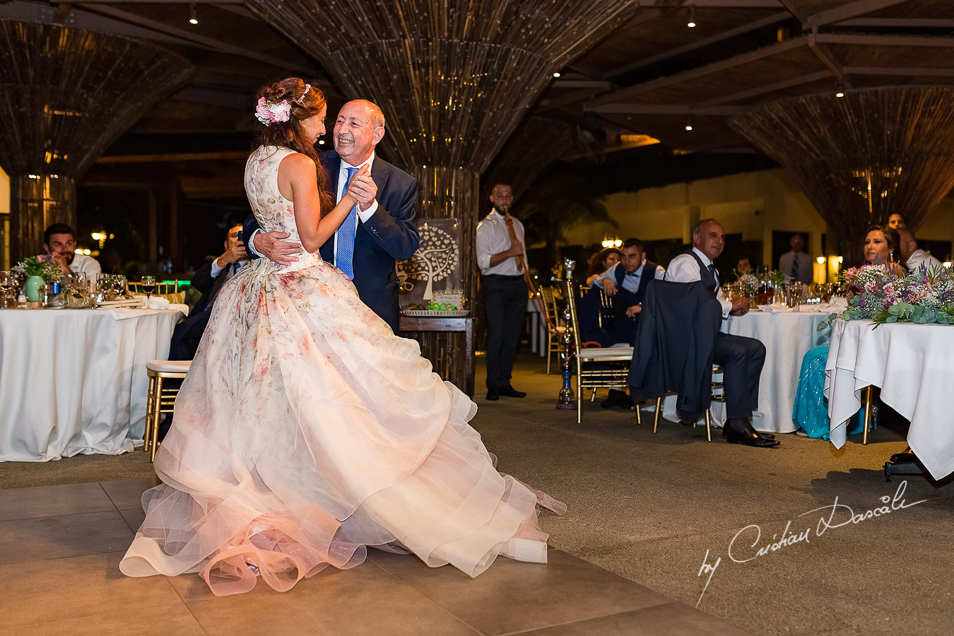 Bride dancing with her father, an emotional moment photographed as part of an Exclusive Wedding photography at Grand Resort Limassol, captured by Cyprus Wedding Photographer Cristian Dascalu.