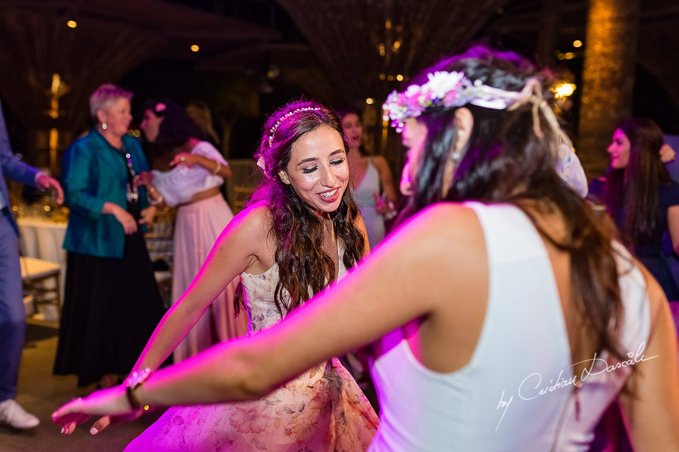 Bride dancing at her wedding, a unique moment photographed as part of an Exclusive Wedding photography at Grand Resort Limassol, captured by Cyprus Wedding Photographer Cristian Dascalu.