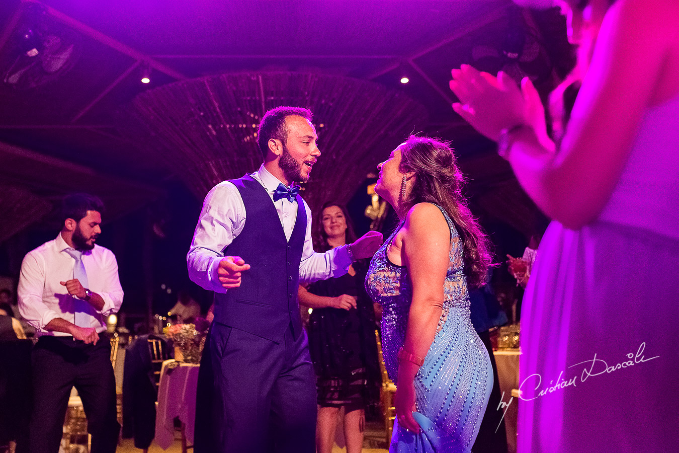 Groom dancing with his mother, a unique moment photographed as part of an Exclusive Wedding photography at Grand Resort Limassol, captured by Cyprus Wedding Photographer Cristian Dascalu.