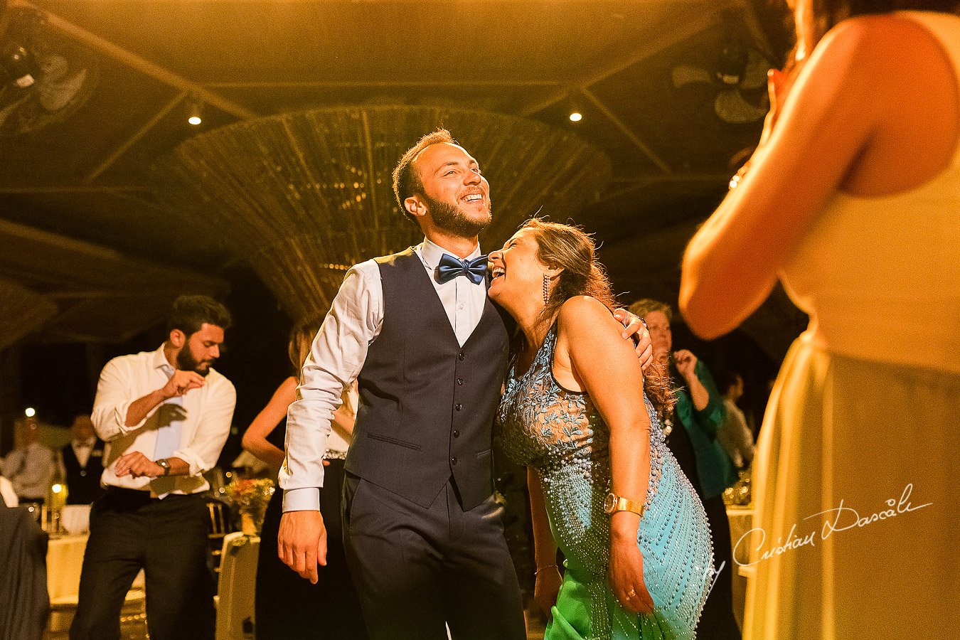 Groom dancing with his mother, a unique moment photographed as part of an Exclusive Wedding photography at Grand Resort Limassol, captured by Cyprus Wedding Photographer Cristian Dascalu.