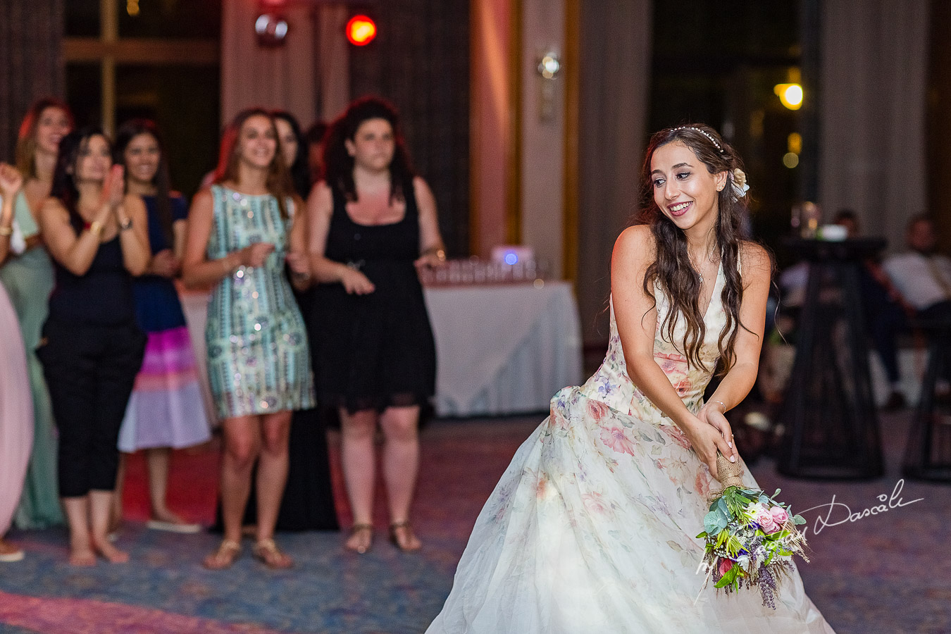 Bride tossing the bouqet photographed as part of an Exclusive Wedding photography at Grand Resort Limassol, captured by Cyprus Wedding Photographer Cristian Dascalu.