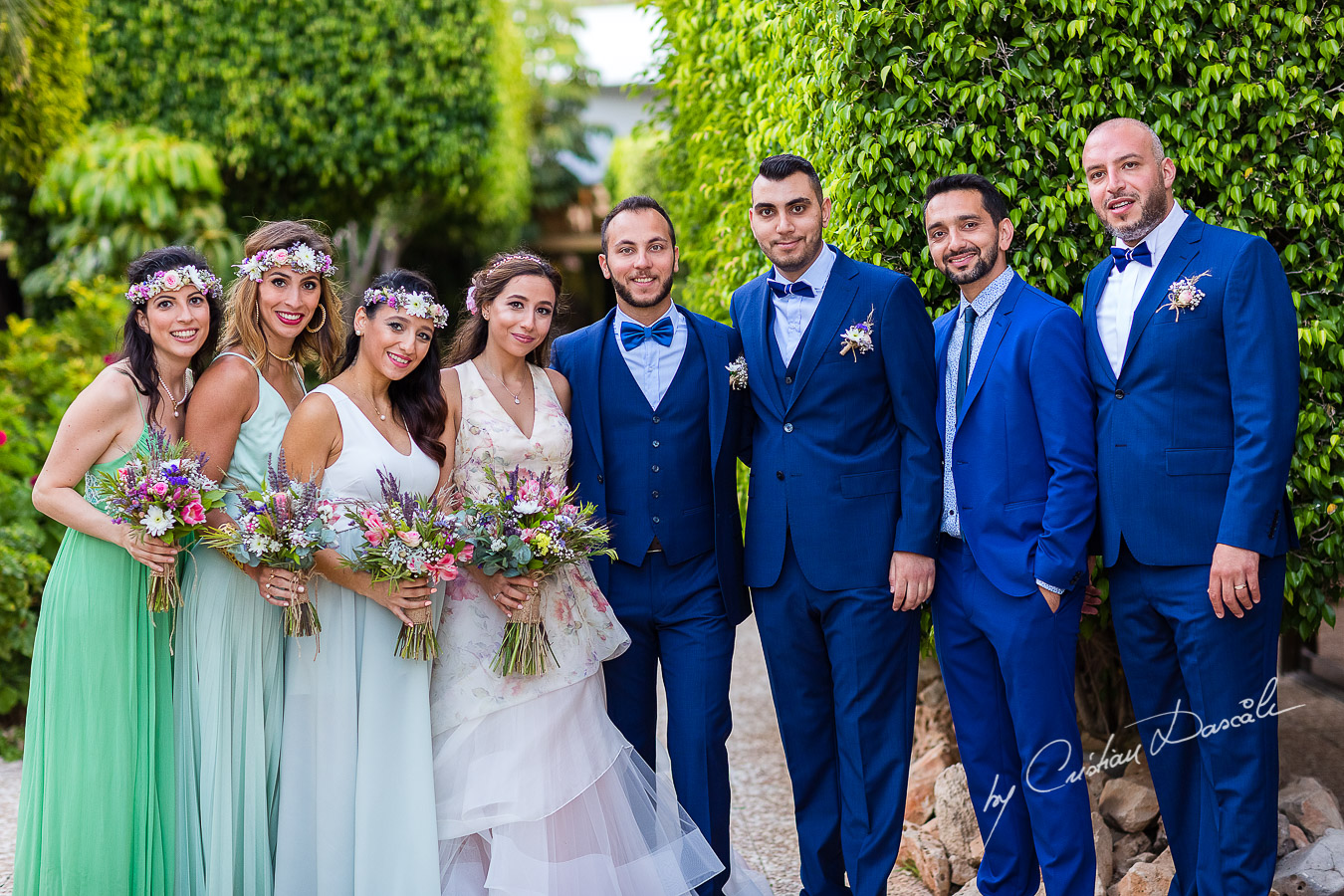 Portrait with the bride and groom and their bridesmaids and groomsmen photographed as part of an Exclusive Wedding photography at Grand Resort Limassol, captured by Cyprus Wedding Photographer Cristian Dascalu.