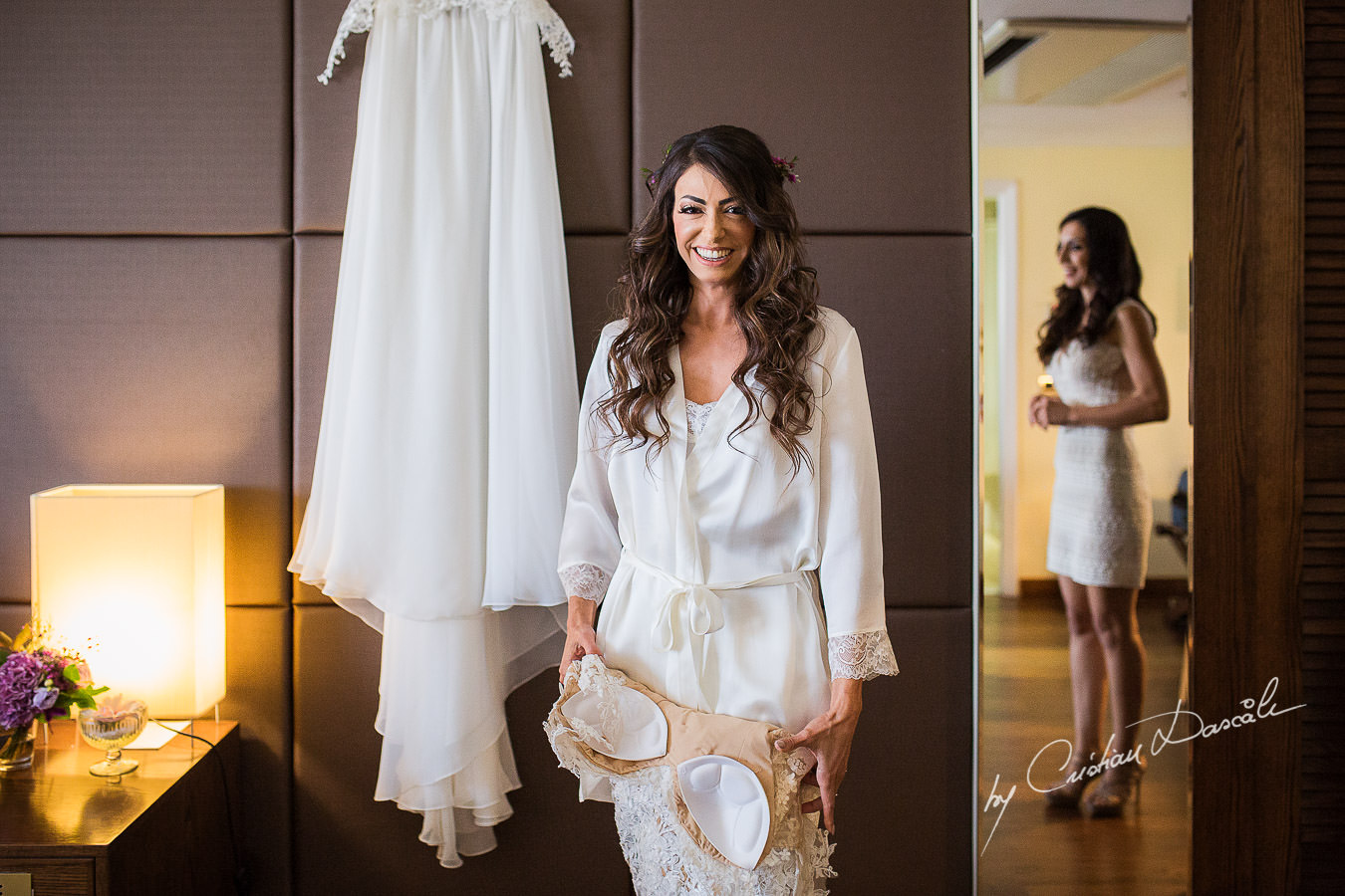 Christiana, the bride, smiling while getting ready for her wedding ceremony, moments captured at a wedding in Cyprus by Cristian Dascalu Photographer.