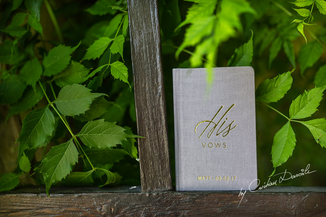 A beautiful wedding day at the Vasilias Nikoklis Inn in Paphos, captured by Cristian Dascalu. Matt's vows book photographed on Inn's gate.