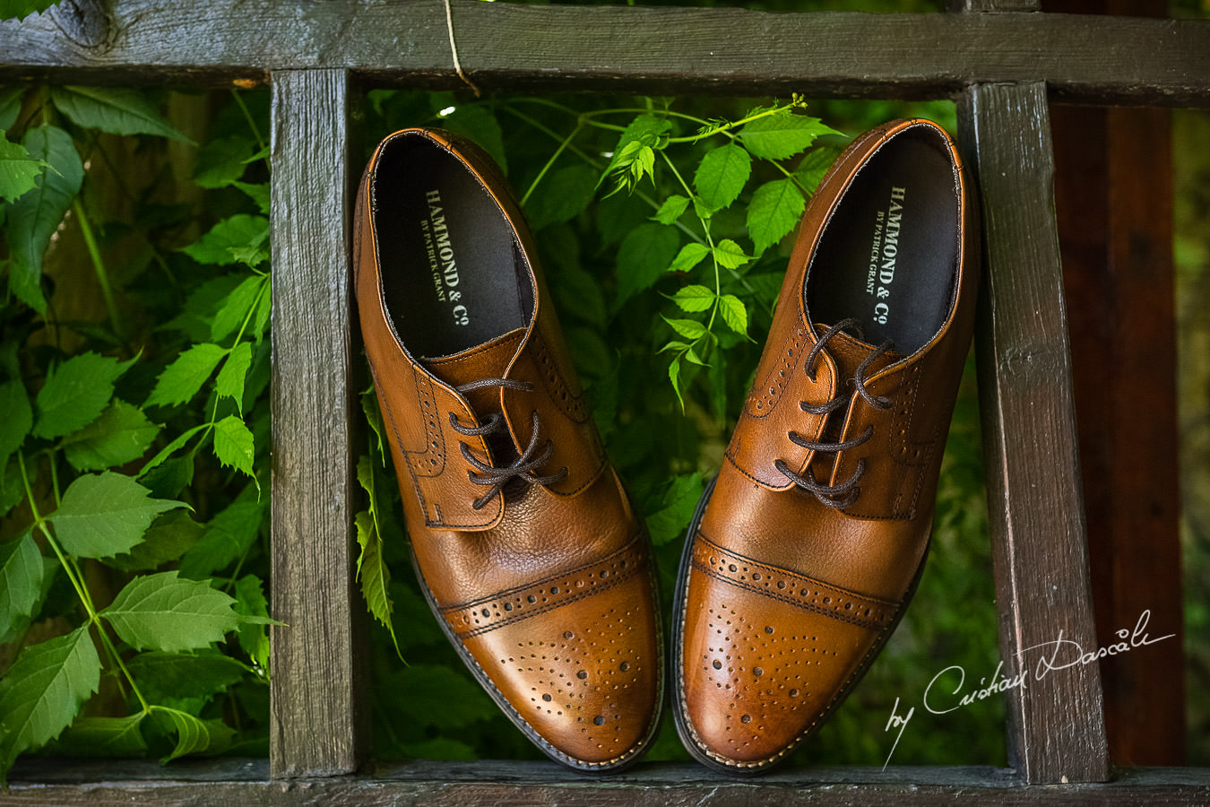 A beautiful wedding day at the Vasilias Nikoklis Inn in Paphos, captured by Cristian Dascalu. Matt's groom shoes photographed on Inn's gate.