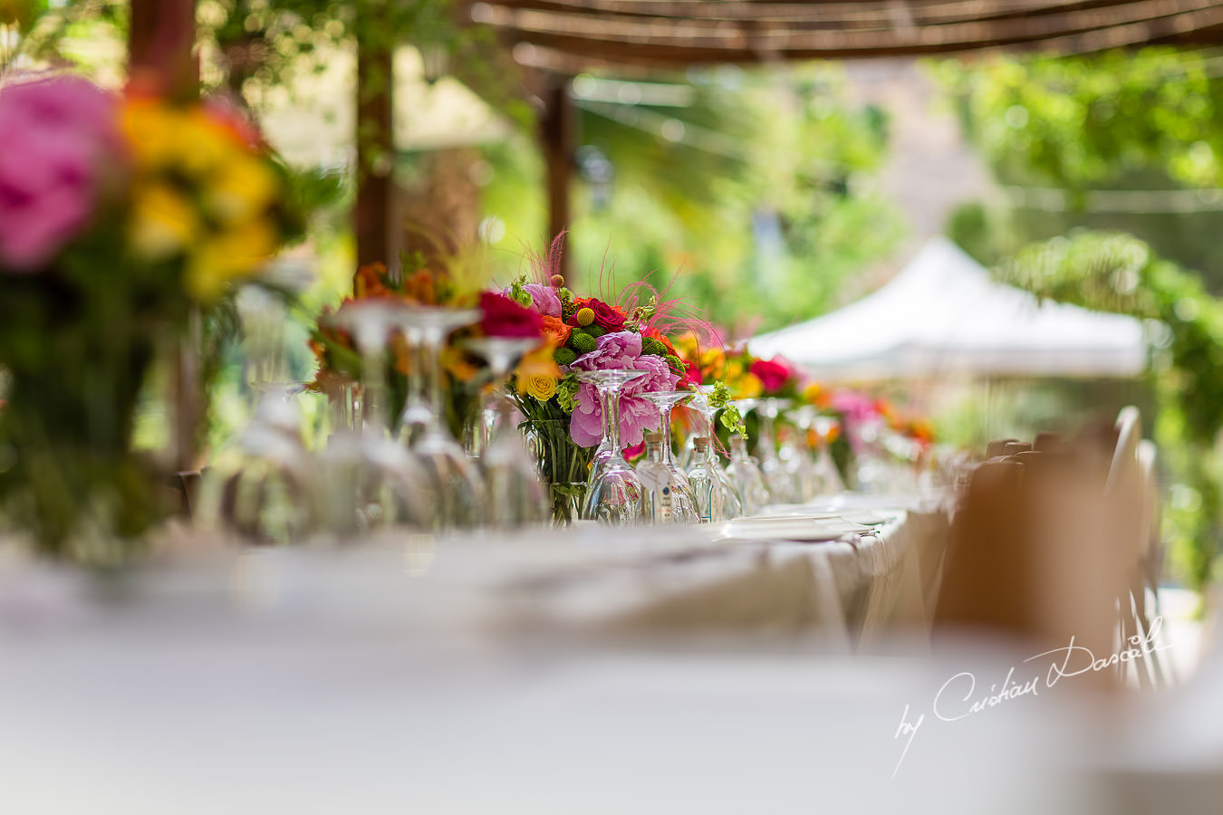 A beautiful wedding day at the Vasilias Nikoklis Inn in Paphos, captured by Cristian Dascalu. The dinner's table.