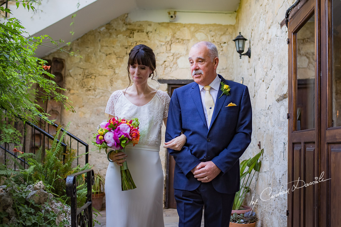 A beautiful wedding day at the Vasilias Nikoklis Inn in Paphos, captured by Cristian Dascalu. Bride's arrival.