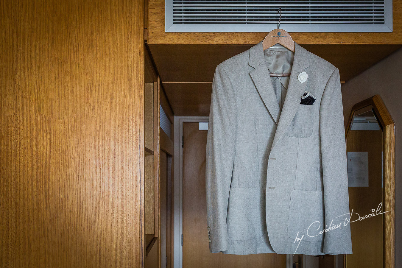 Groom's suit photographed by Cristian Dascalu at Athena Beach Hotel in Paphos, Cyprus, during a symbolic wedding.