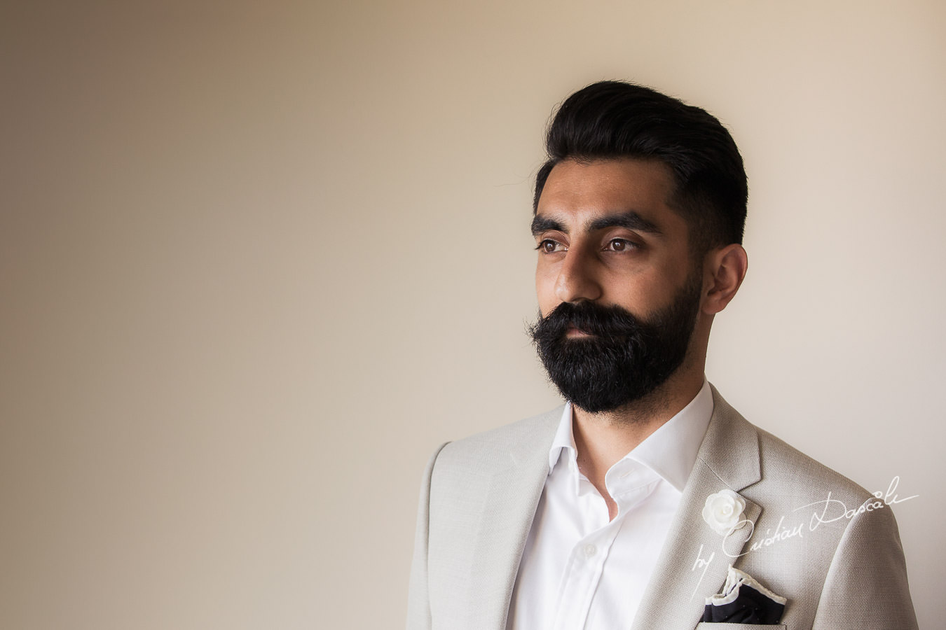 Groom's portrait photographed by Cristian Dascalu at Athena Beach Hotel in Paphos, Cyprus, during a symbolic wedding.