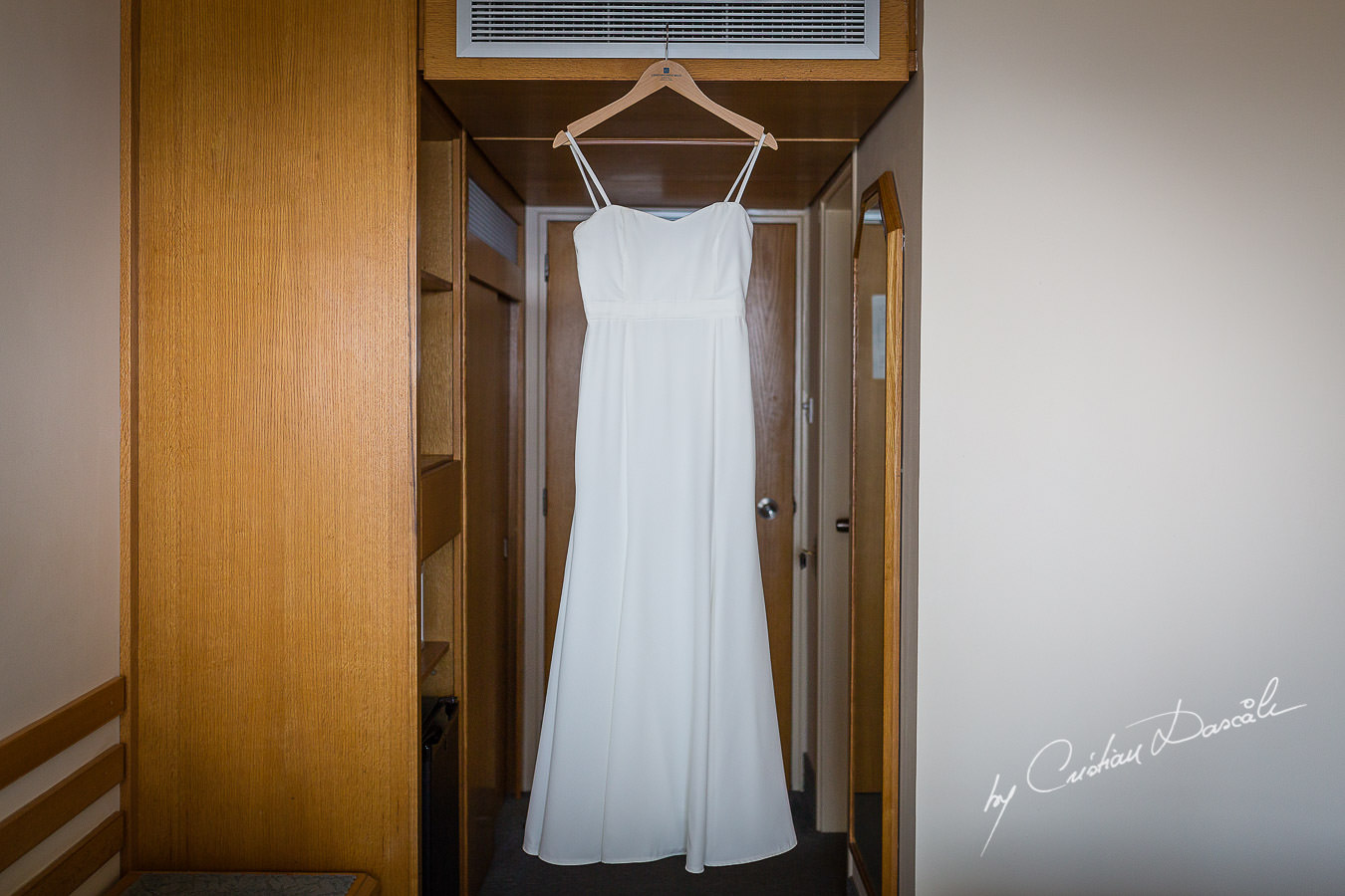 Bride's dress photographed by Cristian Dascalu at Athena Beach Hotel in Paphos, Cyprus, during a symbolic wedding.