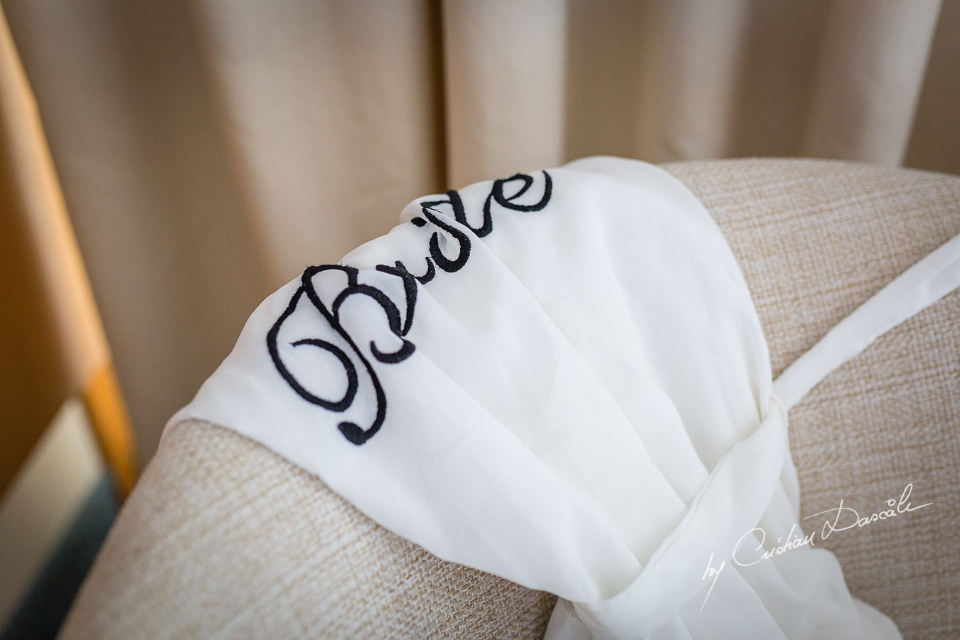 Bride's outfit photographed by Cristian Dascalu at Athena Beach Hotel in Paphos, Cyprus, during a symbolic wedding.