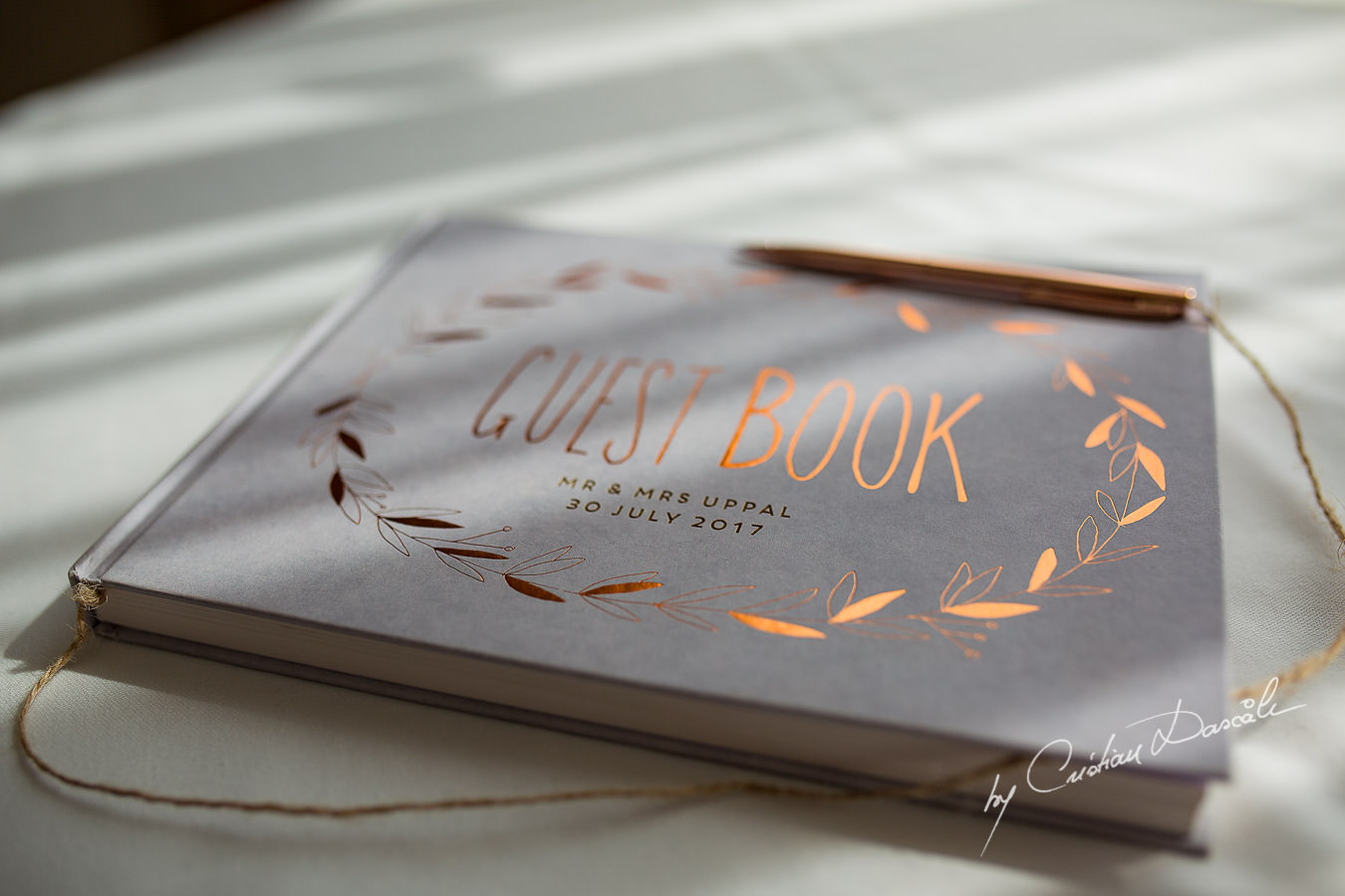 The guest book photographed by Cristian Dascalu at Athena Beach Hotel in Paphos, Cyprus, during a symbolic wedding.