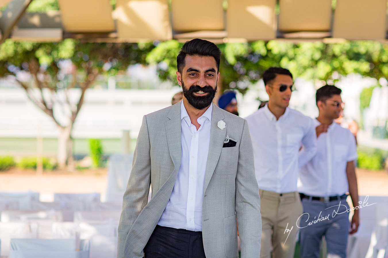 The groom arriving for the wedding ceremony, moments photographed by Cristian Dascalu at Athena Beach Hotel in Paphos, Cyprus, during a symbolic wedding.