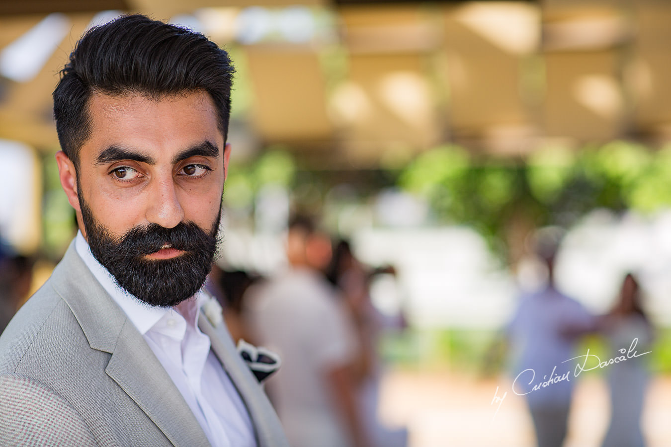 Groom impatiently waiting for his bride, moments photographed by Cristian Dascalu at Athena Beach Hotel in Paphos, Cyprus, during a symbolic wedding.