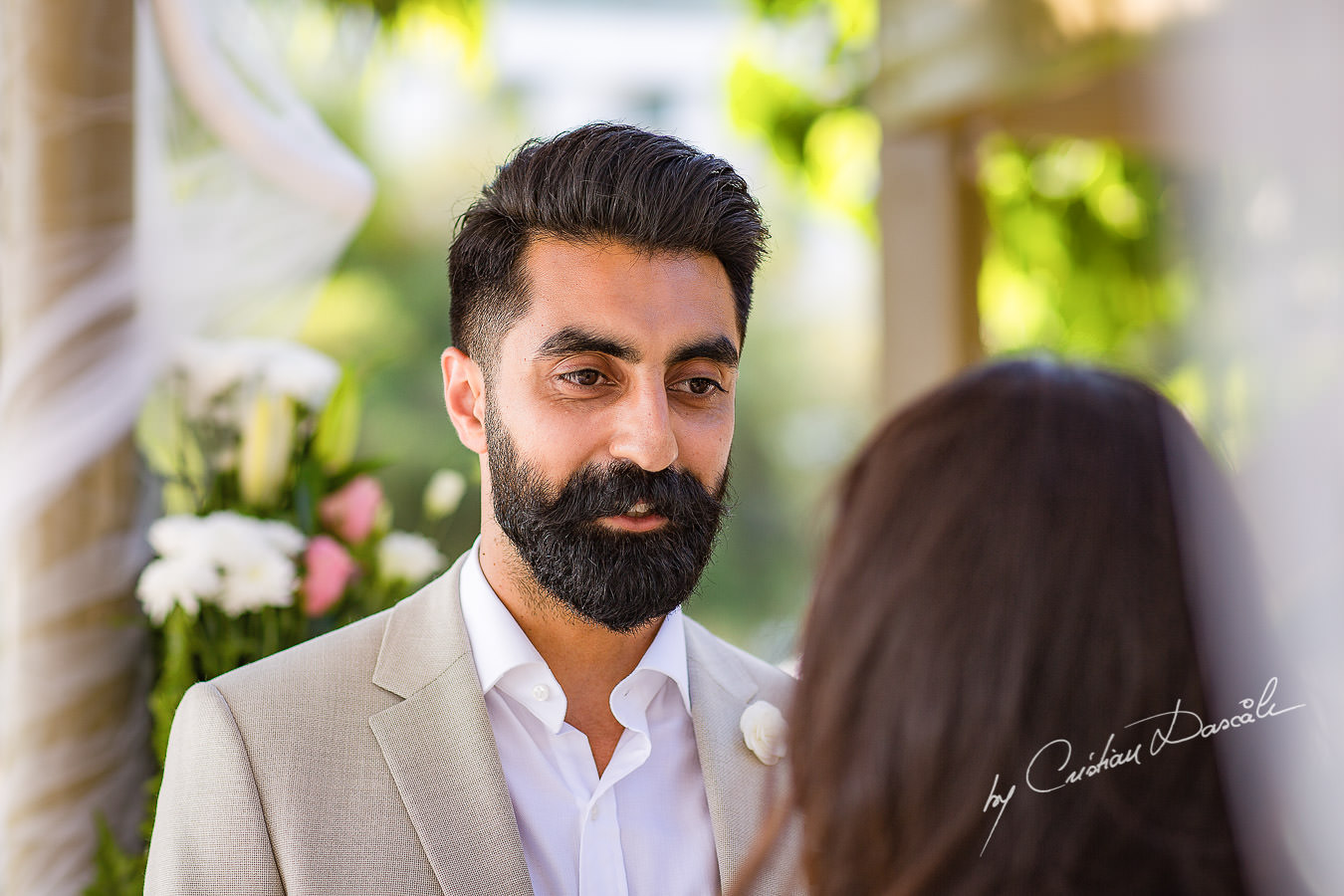 Bride and Groom changing vows, moments photographed by Cristian Dascalu at Athena Beach Hotel in Paphos, Cyprus, during a symbolic wedding.