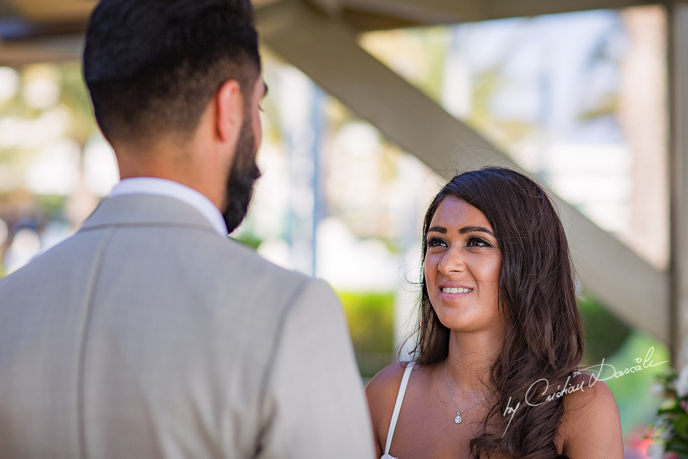 Bride and Groom changing vows, moments photographed by Cristian Dascalu at Athena Beach Hotel in Paphos, Cyprus, during a symbolic wedding.