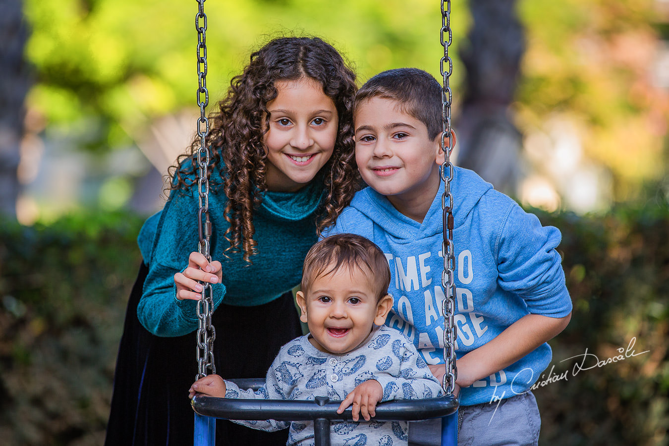 Brothers and sister in the park, moments captured by Cristian Dascalu during a beautiful Limassol family photography photo session.