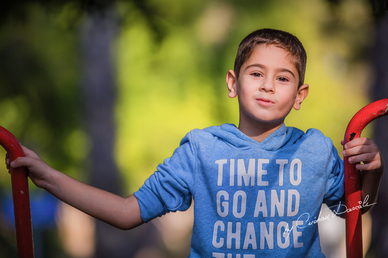 Handsome young boy in the park, moments captured by Cristian Dascalu during a beautiful Limassol family photography photo session.