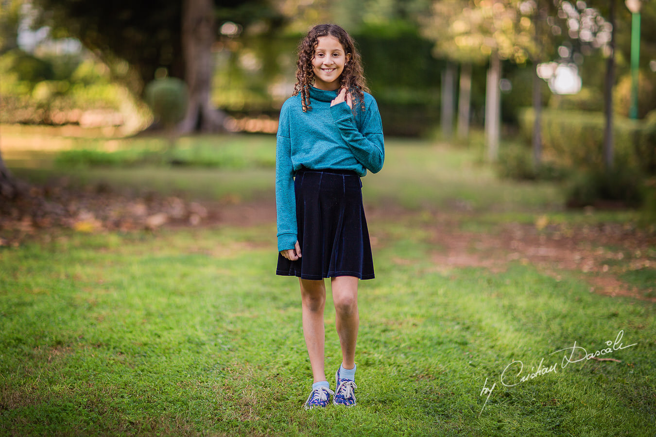 Portrait of a young lady in the park, moments captured by Cristian Dascalu during a beautiful Limassol family photography photo session.