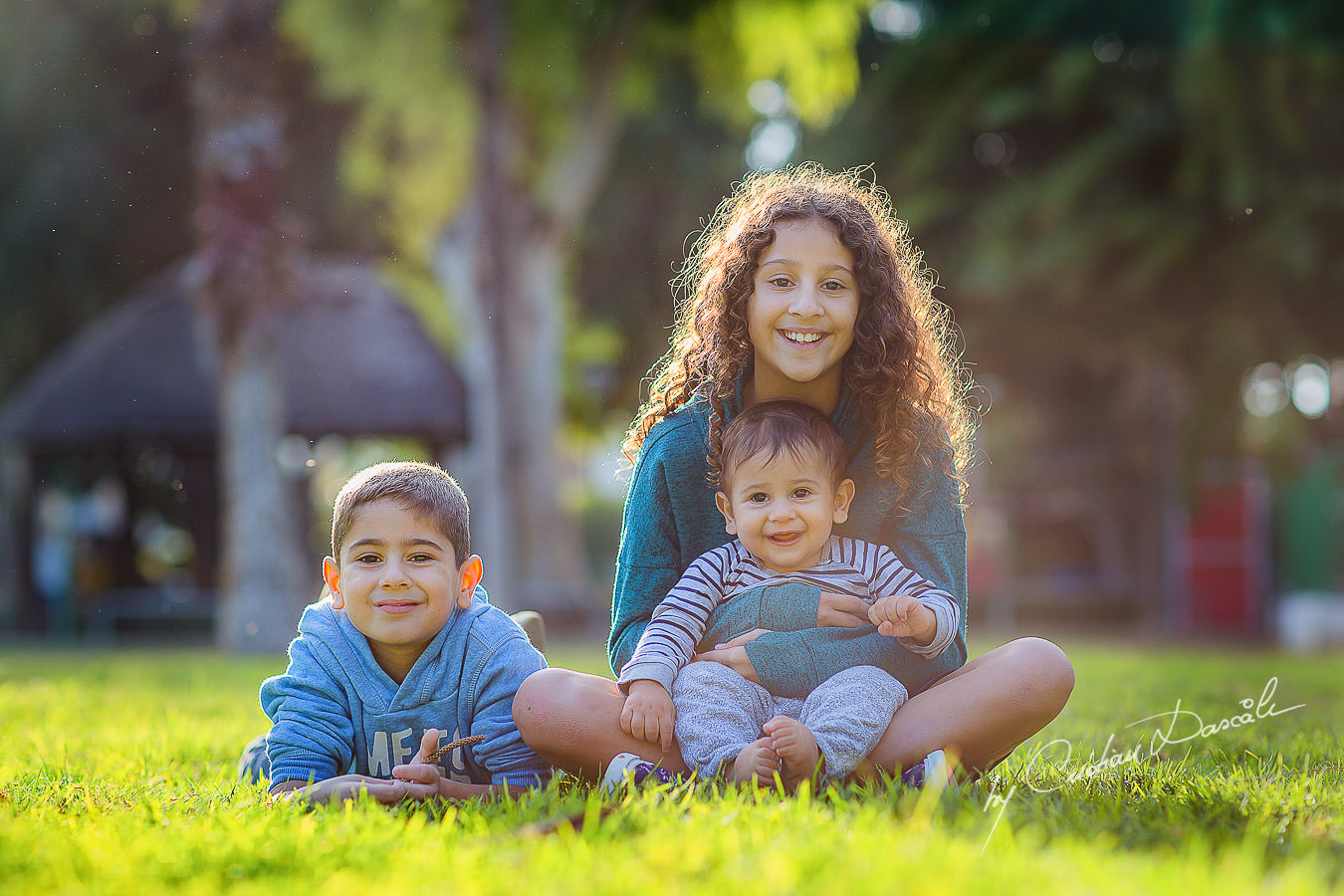 Brothers and sister in the park, moments captured by Cristian Dascalu during a beautiful Limassol family photography photo session.