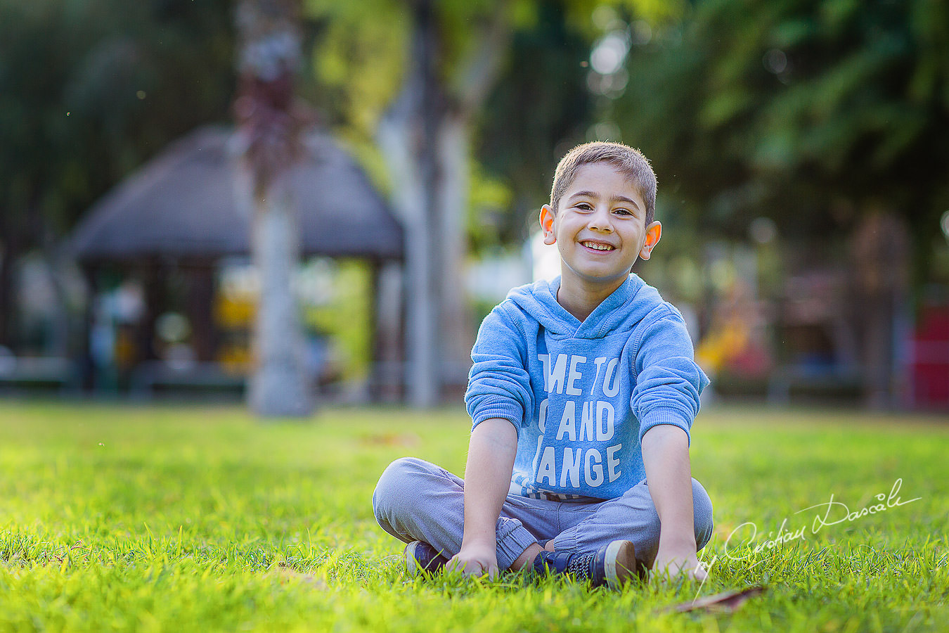 Handsome young boy in the park, moments captured by Cristian Dascalu during a beautiful Limassol family photography photo session.