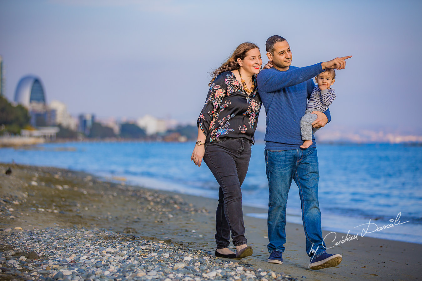 Family walking on a beach, moments captured by Cristian Dascalu during a beautiful Limassol family photography photo session.