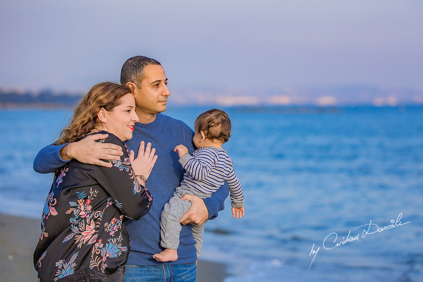 Family walking on a beach, moments captured by Cristian Dascalu during a beautiful Limassol family photography photo session.