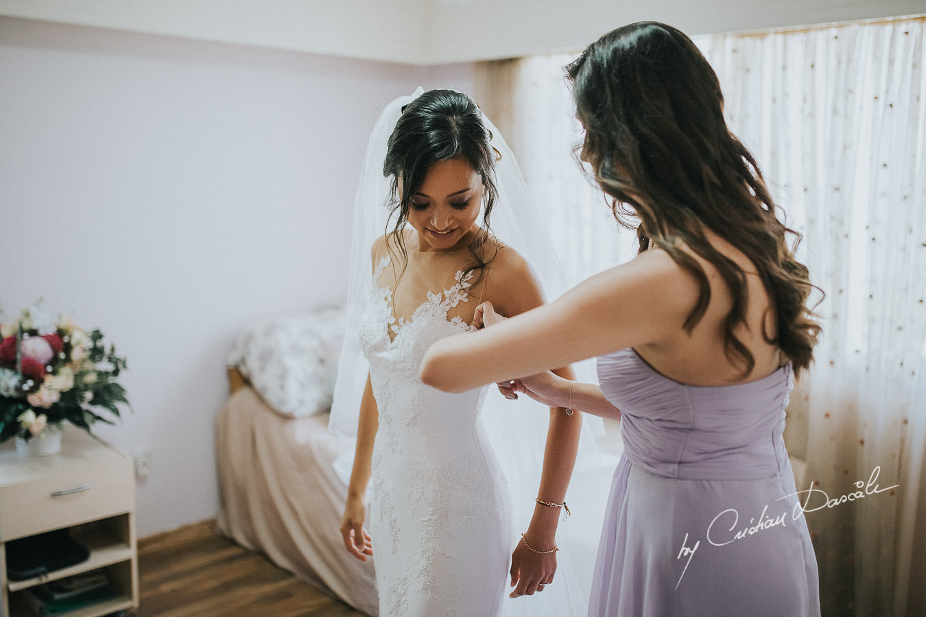 The bride Christina, getting ready for her traditional Cypriot ceremony, moments captured during a wedding at St Raphael Resort in Limassol, Cyprus.