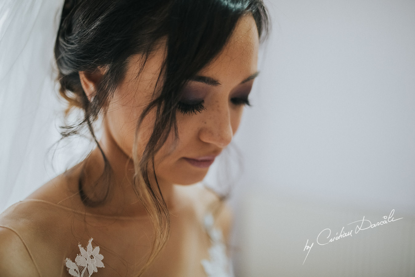 The bride Christina, getting ready for her traditional Cypriot ceremony, moments captured during a wedding at St Raphael Resort in Limassol, Cyprus.