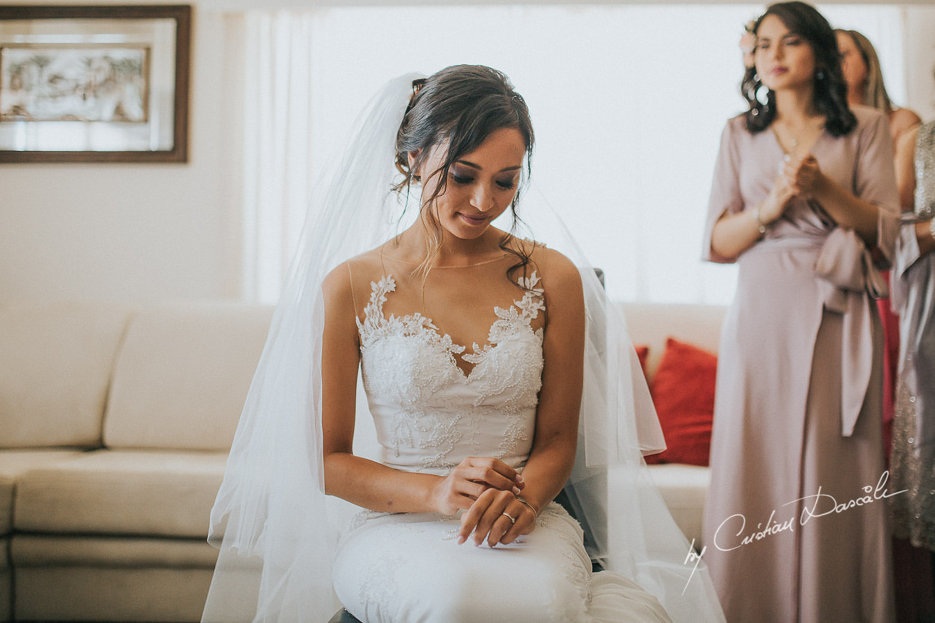 The bride Christina at her traditional wedding ceremony, moments captured during a wedding at St Raphael Resort in Limassol, Cyprus.