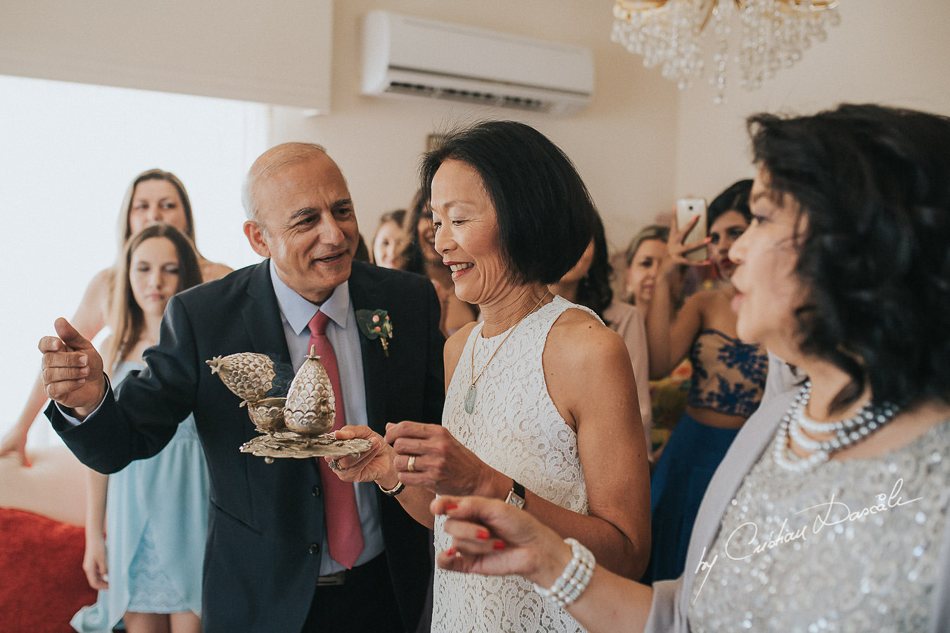 Guest gives her blessing at a traditional wedding ceremony in Limassol, Cyprus.