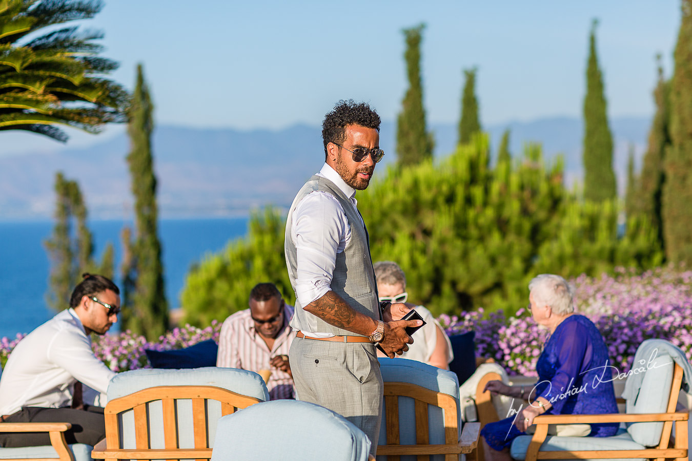 The father of the baby just Christened at the beautiful Anassa Hotel photographed by Cyprus Photographer Cristian Dascalu.