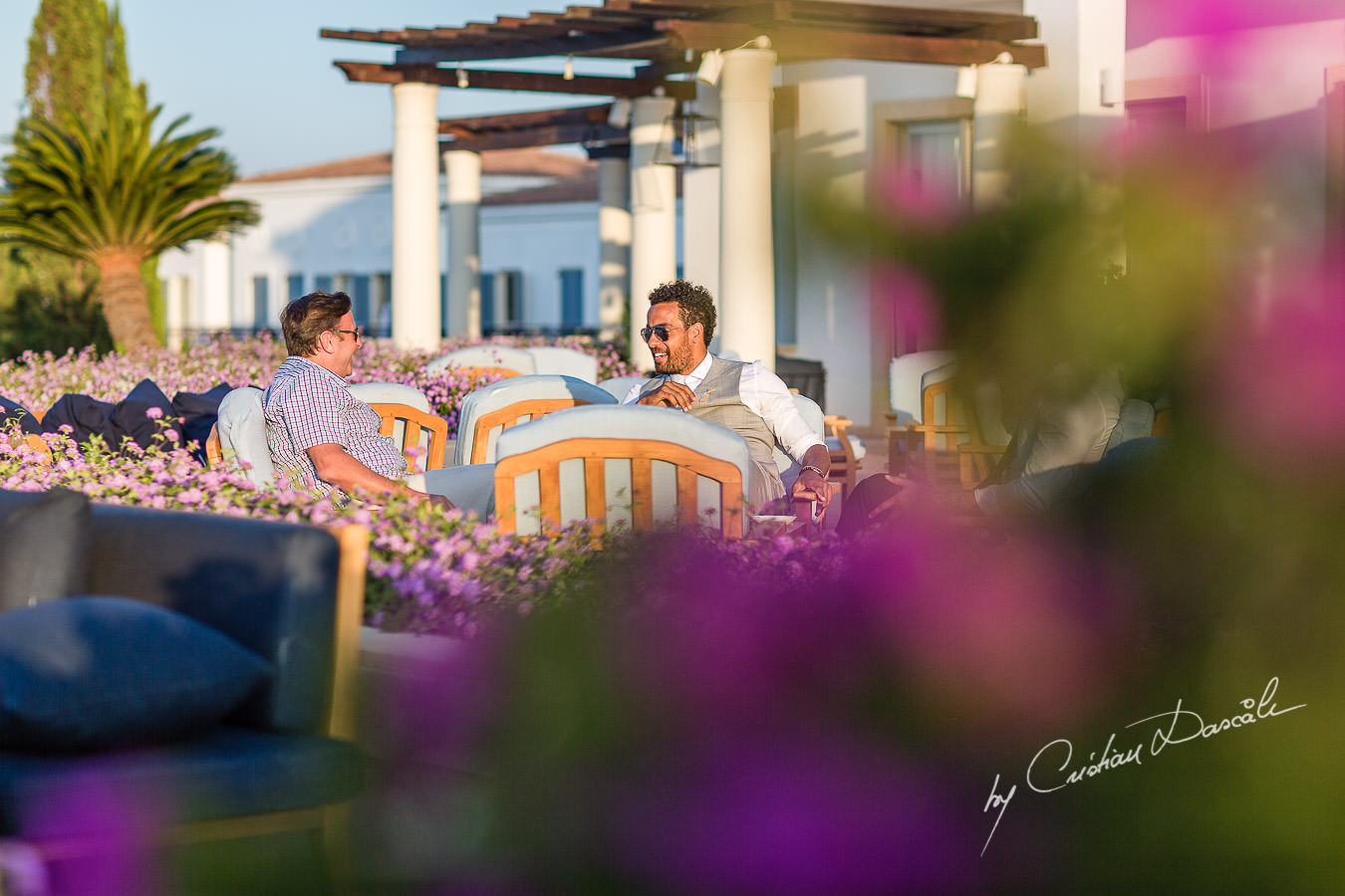 Guests chatting at the beautiful Anassa Hotel photographed by Cyprus Photographer Cristian Dascalu.
