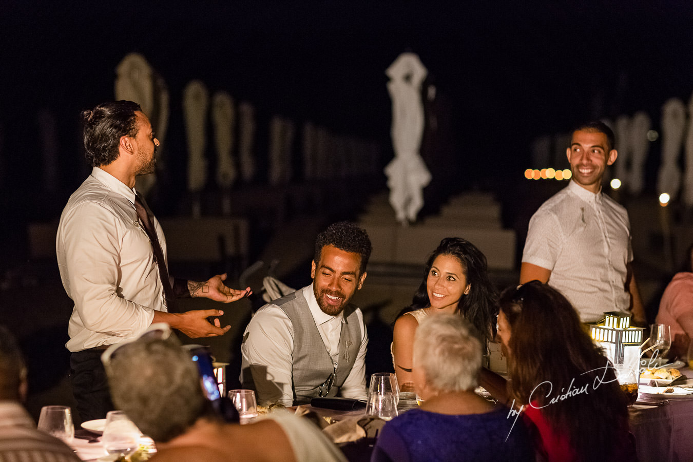 Guests chatting at the beautiful Anassa Hotel photographed by Cyprus Photographer Cristian Dascalu.