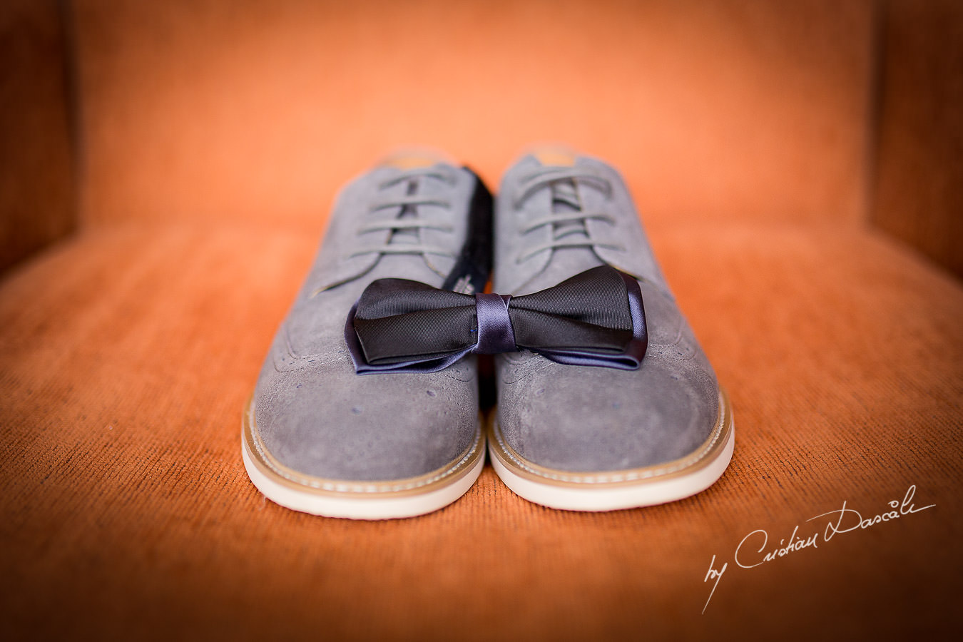 Groom's shoes and bow-tie at a Beautiful Wedding at Elias Beach Hotel captured by Cyprus Photographer Cristian Dascalu.