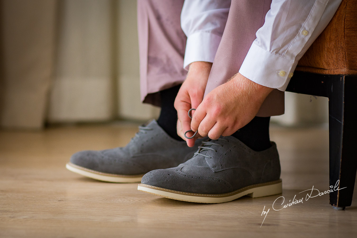 Groom getting ready at a Beautiful Wedding at Elias Beach Hotel captured by Cyprus Photographer Cristian Dascalu.