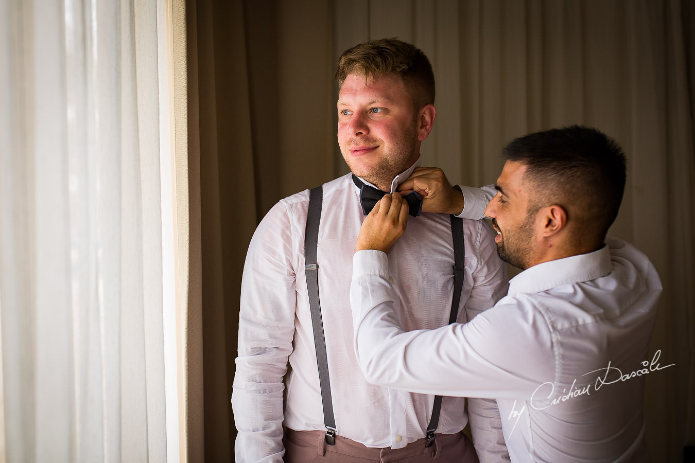 Groom and best man at a Beautiful Wedding at Elias Beach Hotel captured by Cyprus Photographer Cristian Dascalu.