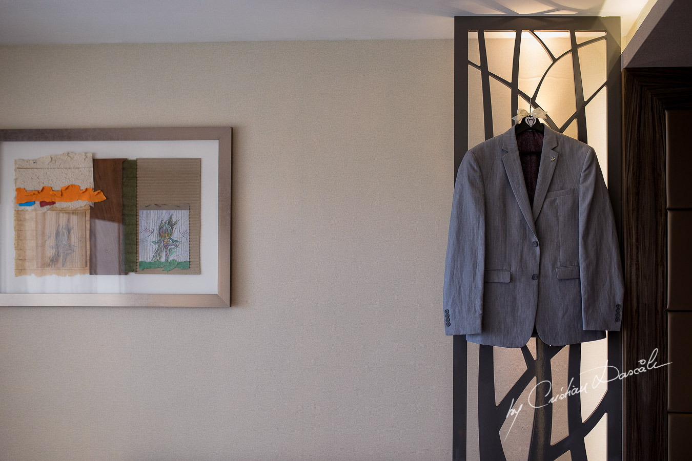 Groom's neat suit captured during an Exquisite Wedding at Asterias Beach Hotel by Cyprus Photographer Cristian Dascalu.