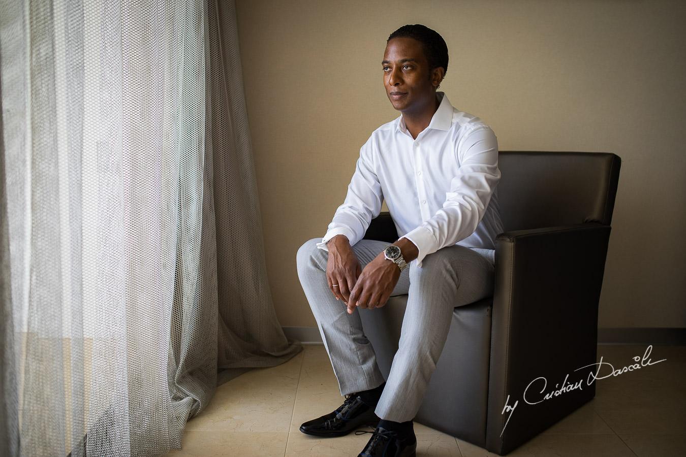 Groom portrait captured during an Exquisite Wedding at Asterias Beach Hotel by Cyprus Photographer Cristian Dascalu.