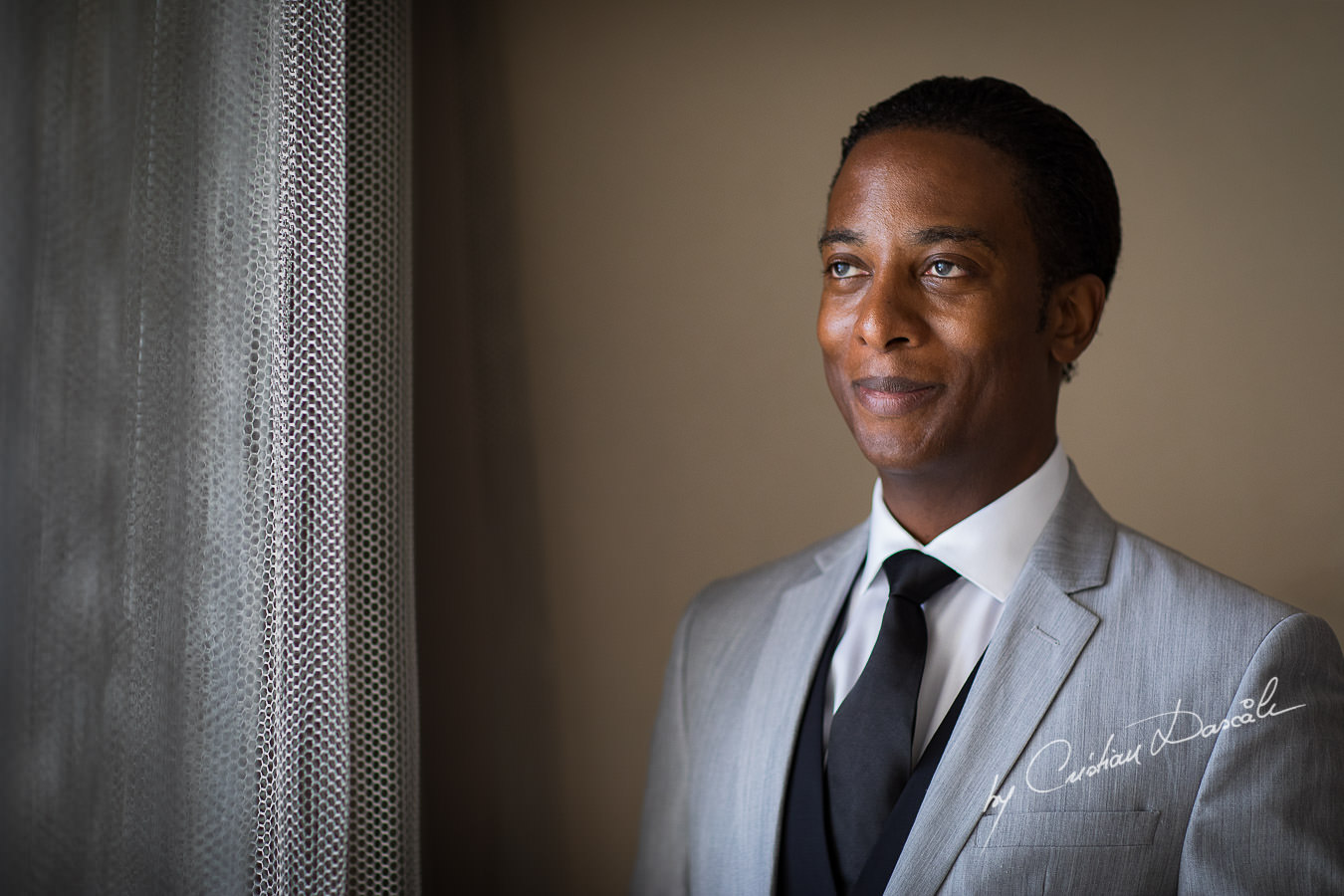 Groom portrait captured during an Exquisite Wedding at Asterias Beach Hotel by Cyprus Photographer Cristian Dascalu.