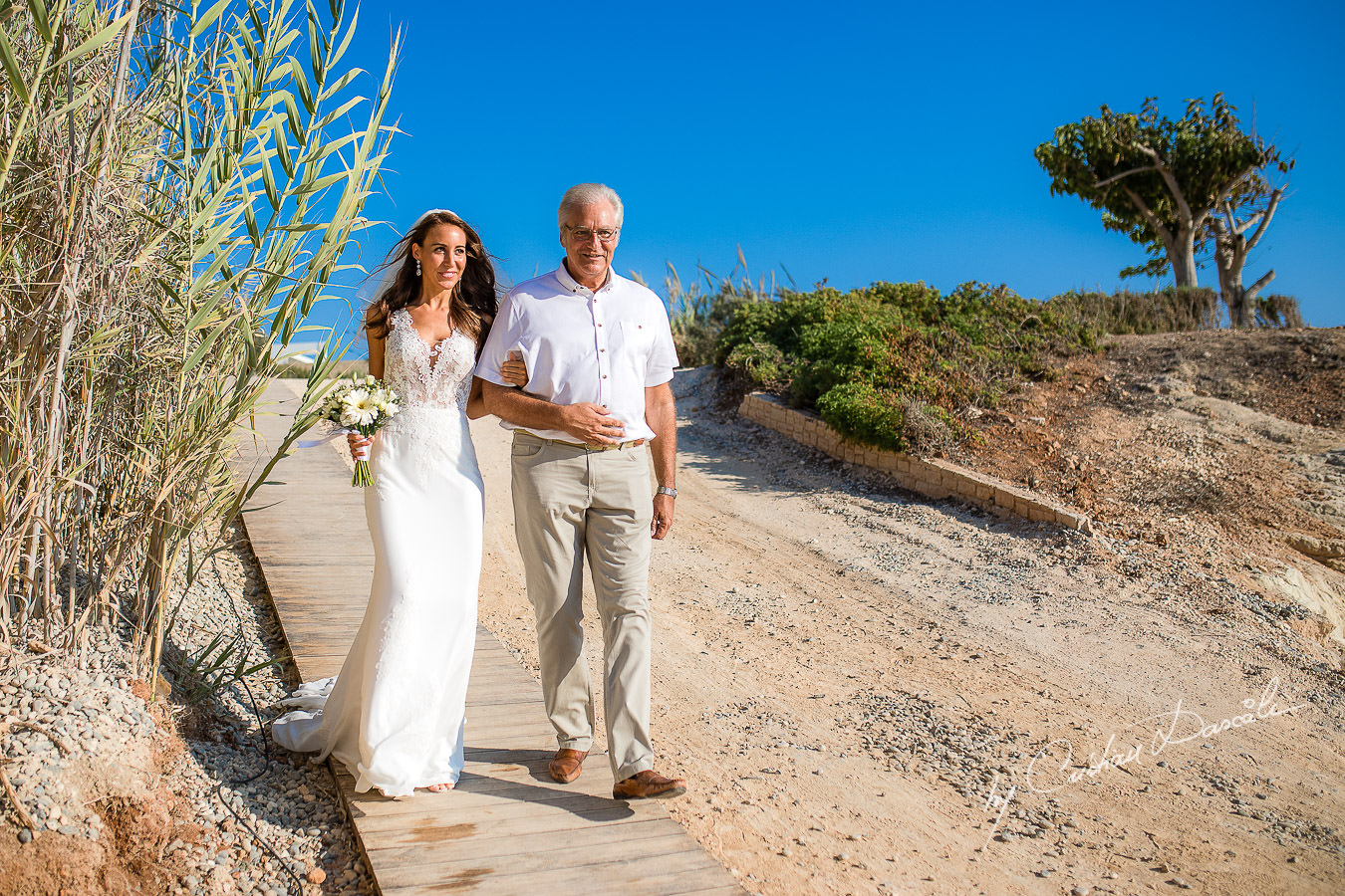 Bride arrival photographed by Cyprus Photographer Cristian Dascalu during a beautiful wedding at Cap St. George in Paphos.