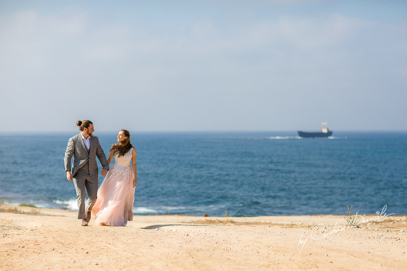 Bride and Groom's arrival, with M/V Demetrios II Shipwreck in the background, captured by Cyprus Wedding Photographer Cristian Dascalu.