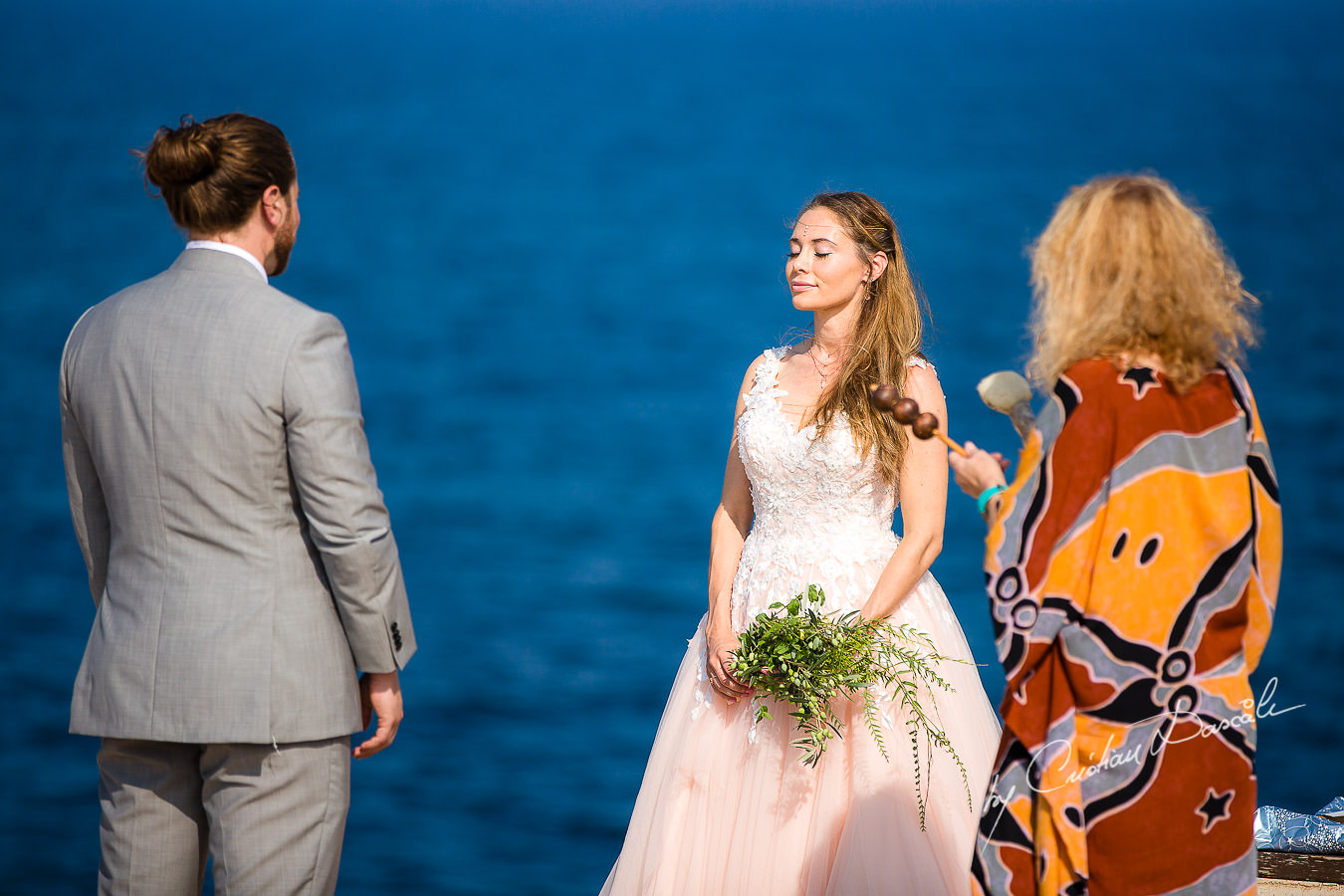 The shaman, bride and groom, moments captured at a Shamanic Wedding Ceremony by Cyprus Wedding Photographer Cristian Dascalu.