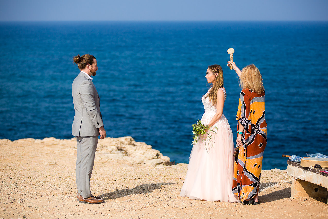 The shaman blessing the bride, moments captured by Cyprus Wedding Photographer Cristian Dascalu.