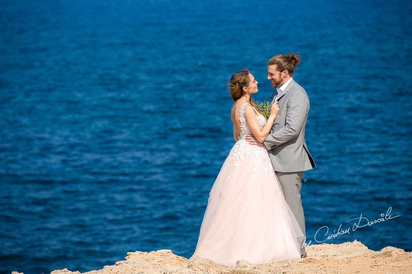 Bride and groom posing on the beach, moments captured at a Shamanic Wedding Ceremony by Cyprus Wedding Photographer Cristian Dascalu.